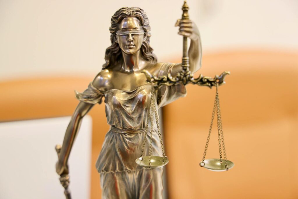 close up of lady justice statue with scales